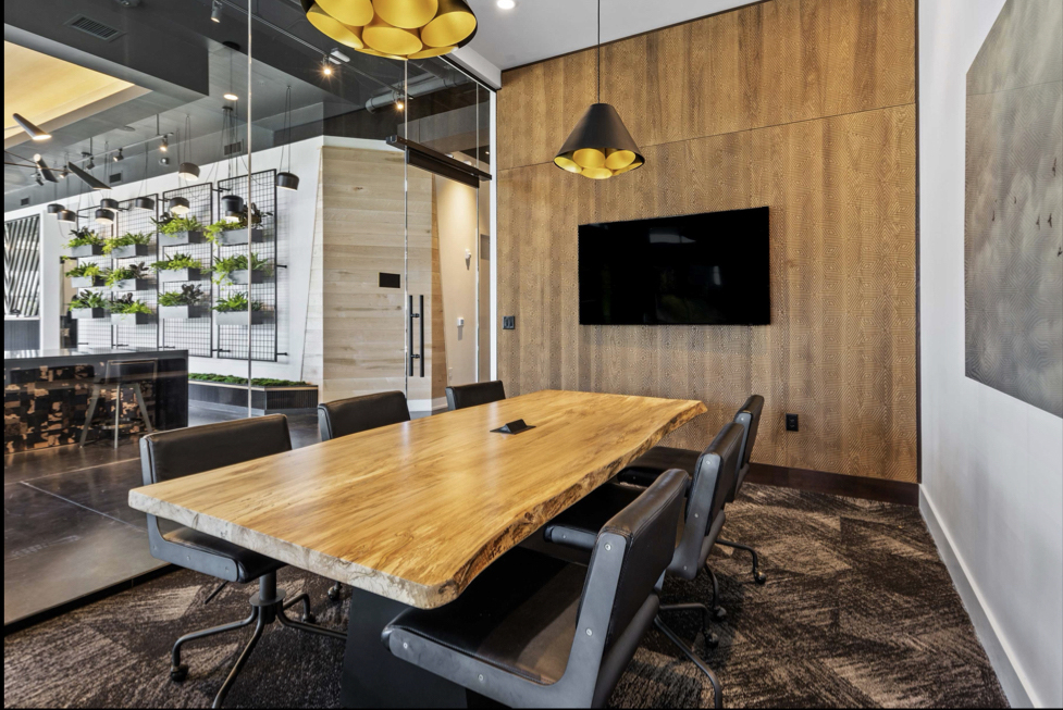 Live edge wormy maple conference table with steel base and power module