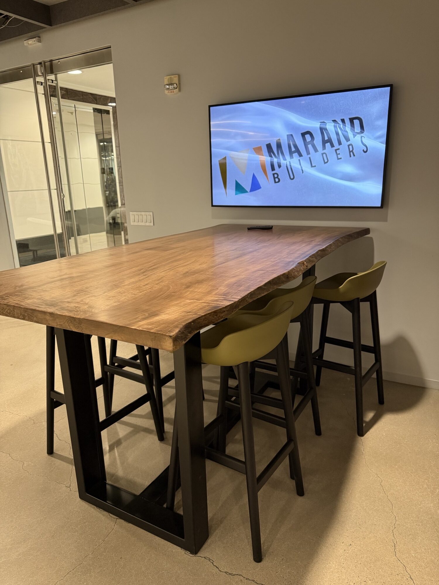 Live edge wormy maple community table with steel base