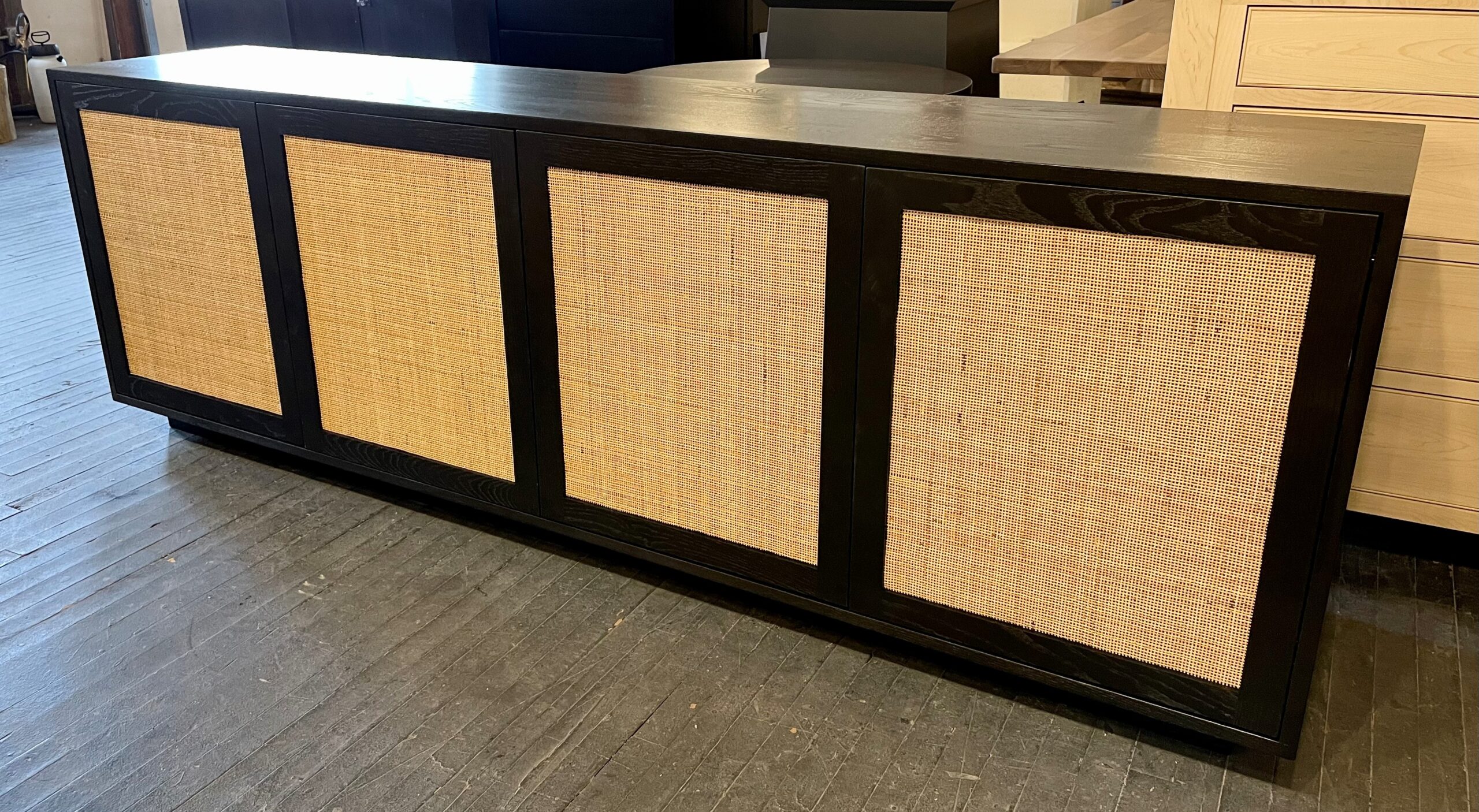 Walnut console with caning accents